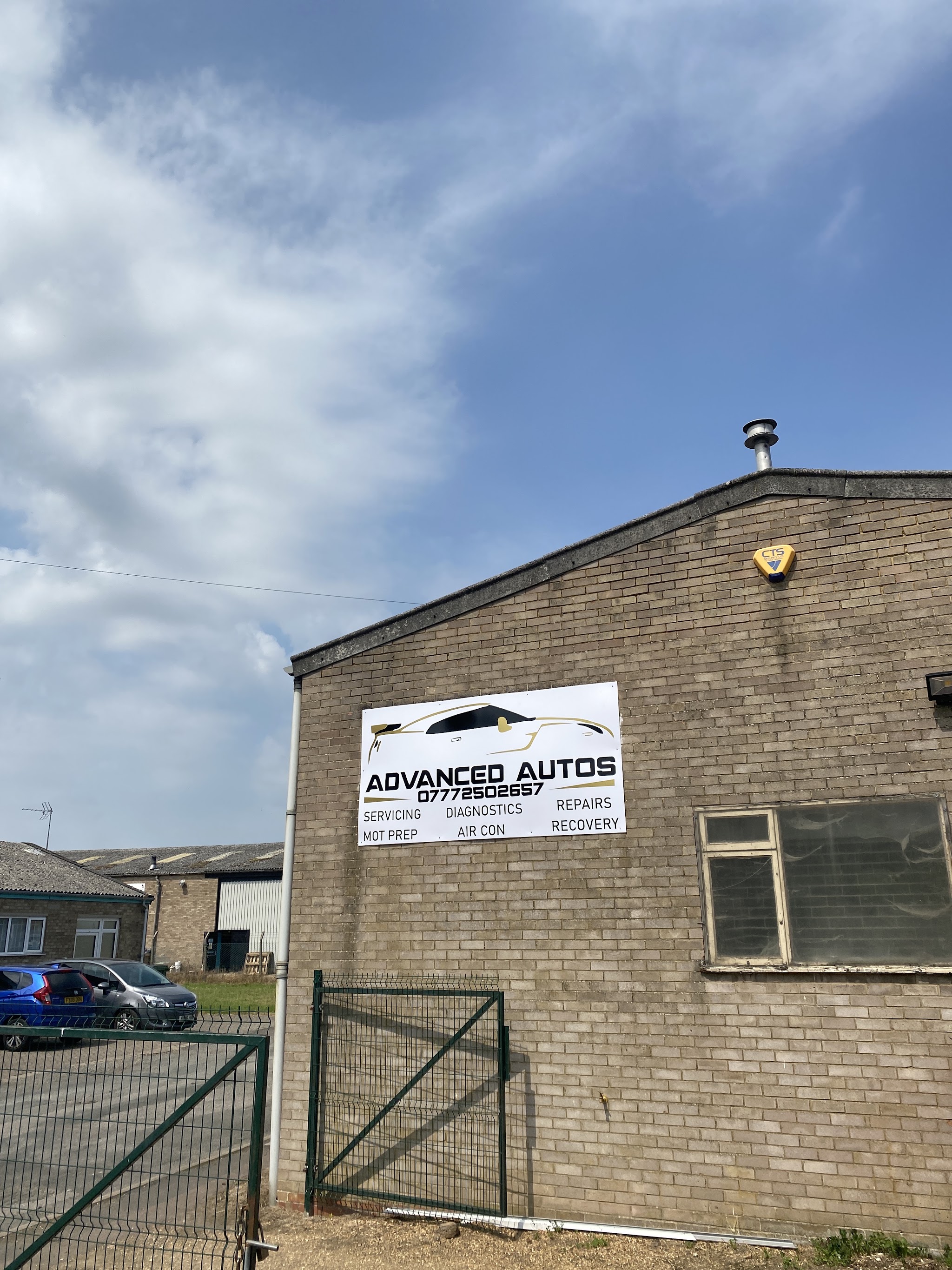 The Advanced Autos unit with its sign on the gable end