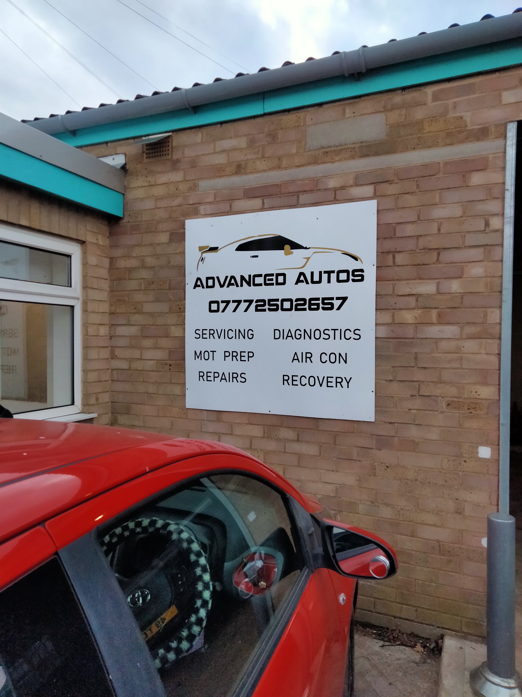 The Advanced Autos sign listing servicing, diagnostics, MOT prep, air con, repairs and recovery