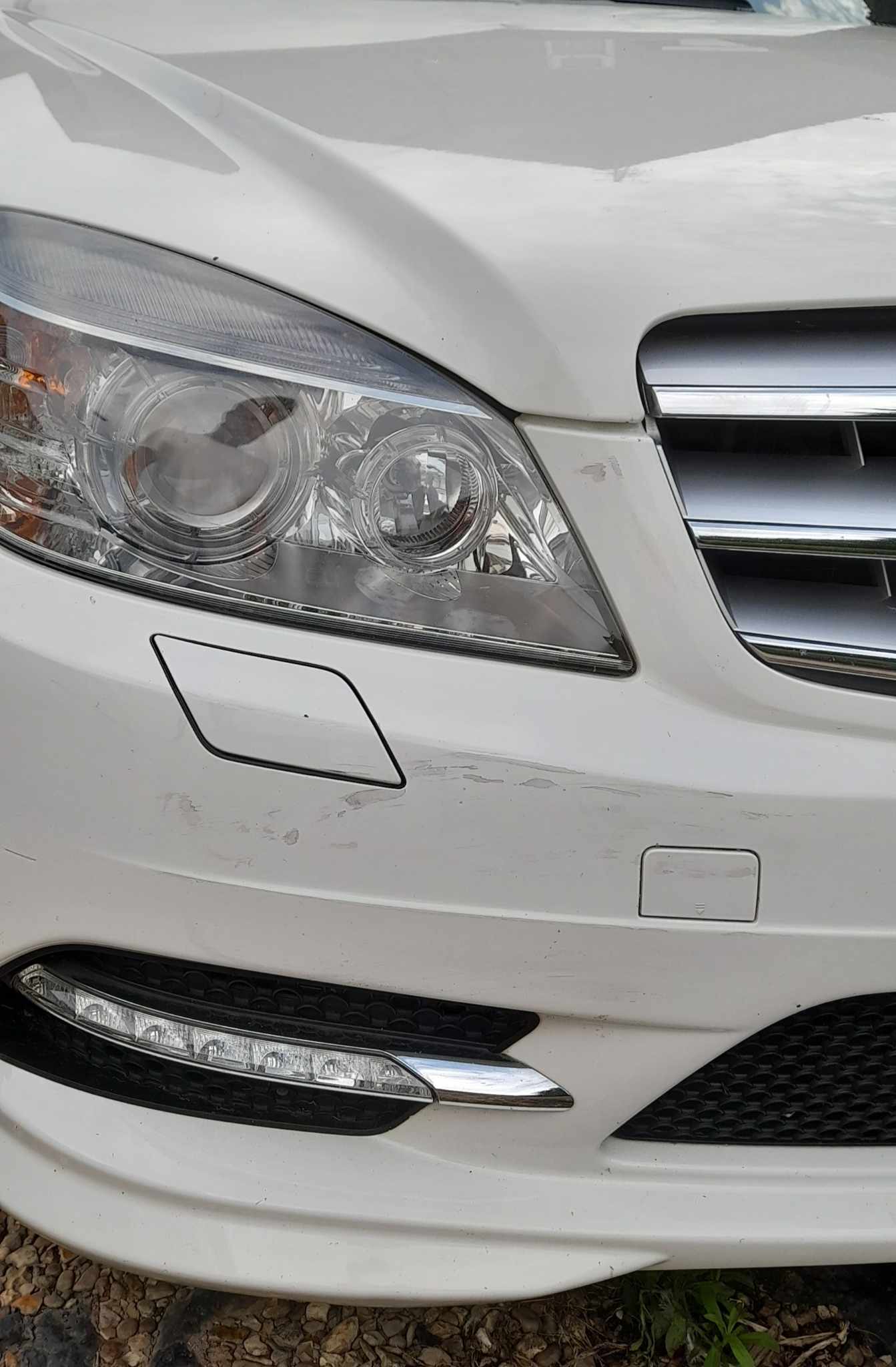 Close-up of a white Mercedes headlight